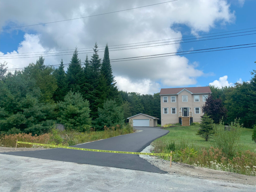 long paved asphalt residential driveway